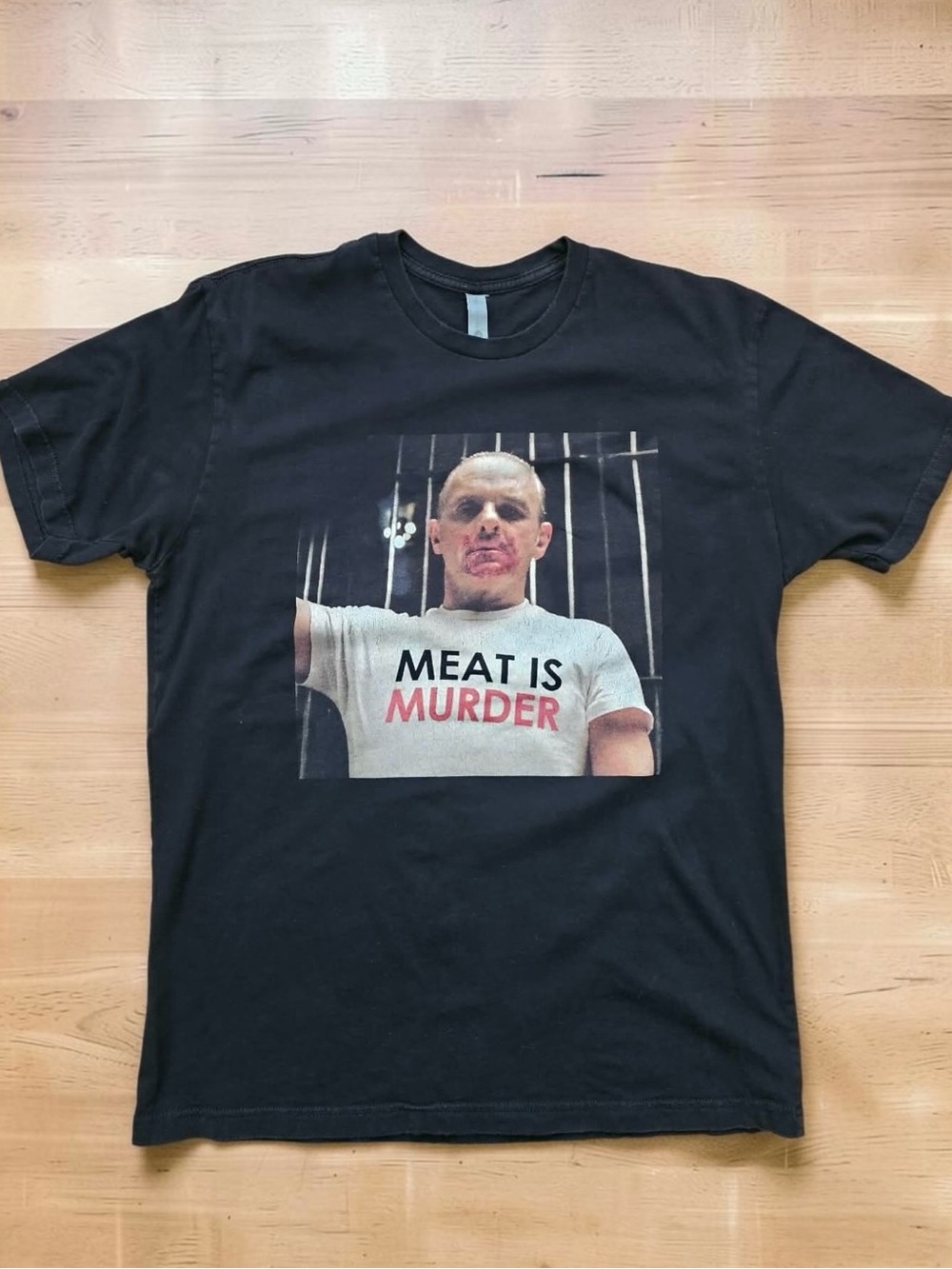 Black Graphic Hannibal Horror Tee with 'Meat Is Murder' Slogan